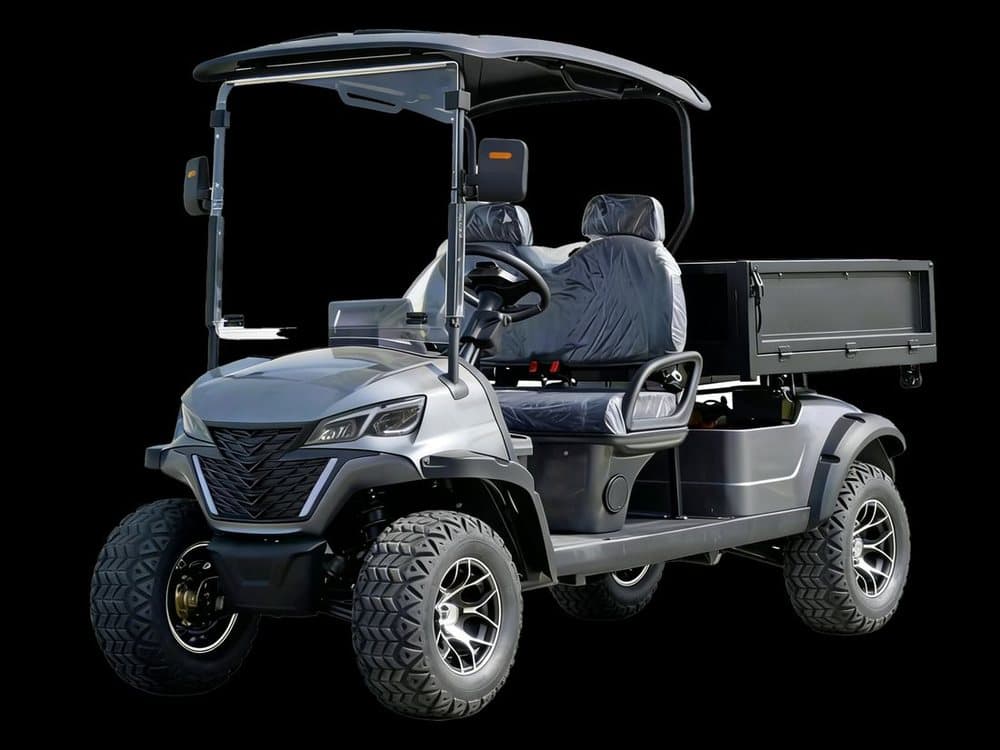 Four-wheel electric utility golf cart with rear cargo bed and off-road tires